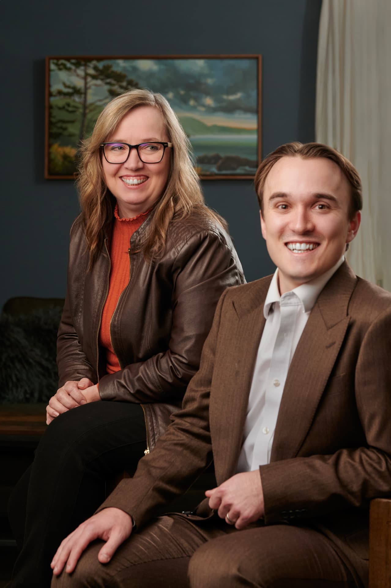 Heather and Jared sharing a laugh in their office